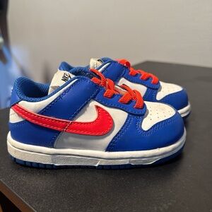 Nike Kids White and Blue Sneakers with Red Accents